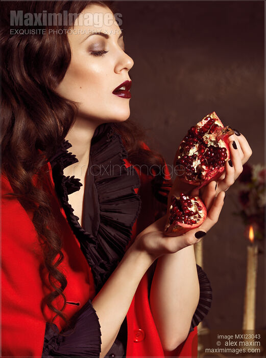 Beautiful Woman with a Pomegranate Stock photo of Beautiful Woman with a Pomegranate Buy commercial use license at MaximImages
