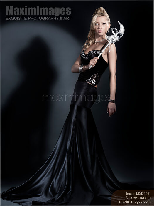 Stock photo of Beautiful Woman with a Venetian Mask Buy commercial use license at MaximImages
