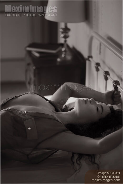 Beautiful woman with bared chest making love in bed arching her chest Sensual black and white portrait Stock photo of Beautiful woman with bared chest making love in bed arching her chest Sensual black and white portrait Buy commercial use license at MaximImages