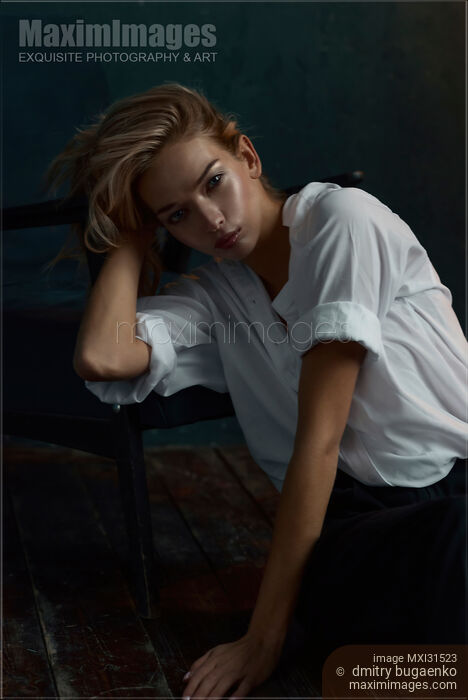 Stock photo of Beautiful woman with blond hair and an expressive look Buy commercial use license at MaximImages