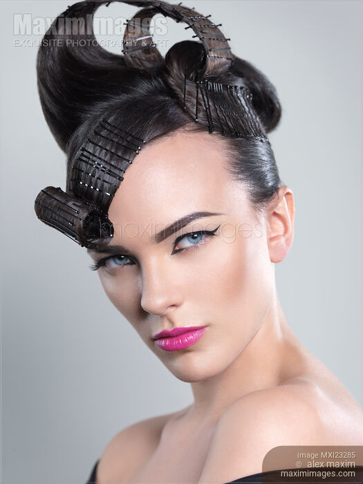 Stock photo of Beautiful Woman with Creative Hairstyle Buy commercial use license at MaximImages