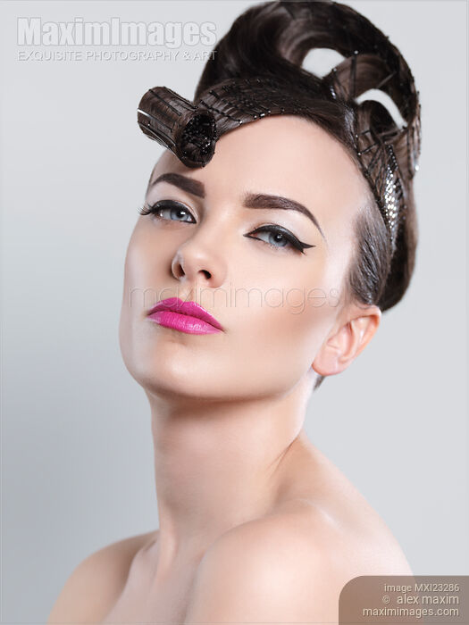 Stock photo of Beautiful Woman with Creative Hairstyle Buy commercial use license at MaximImages