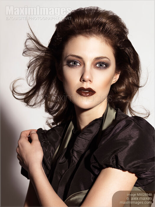 Stock photo of Beautiful woman with dramatic makeup expressive portrait Buy commercial use license at MaximImages