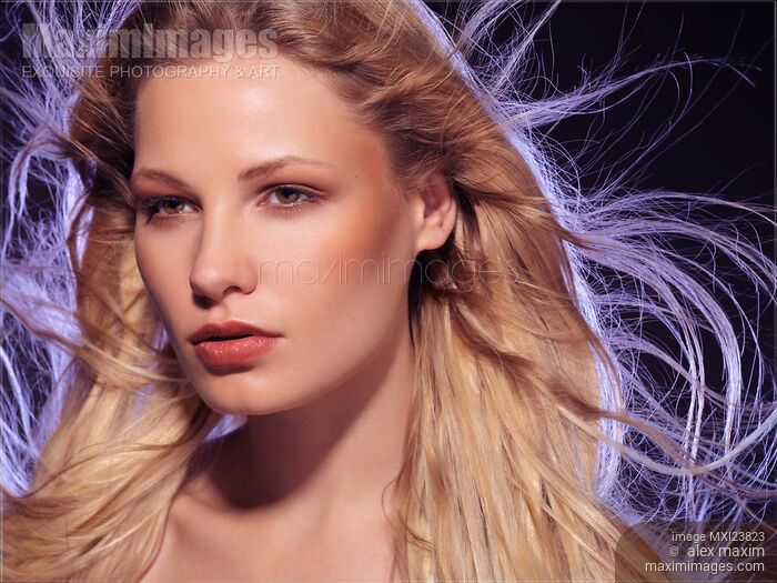 Stock photo of Beautiful Woman with Flying Hair Buy commercial use license at MaximImages