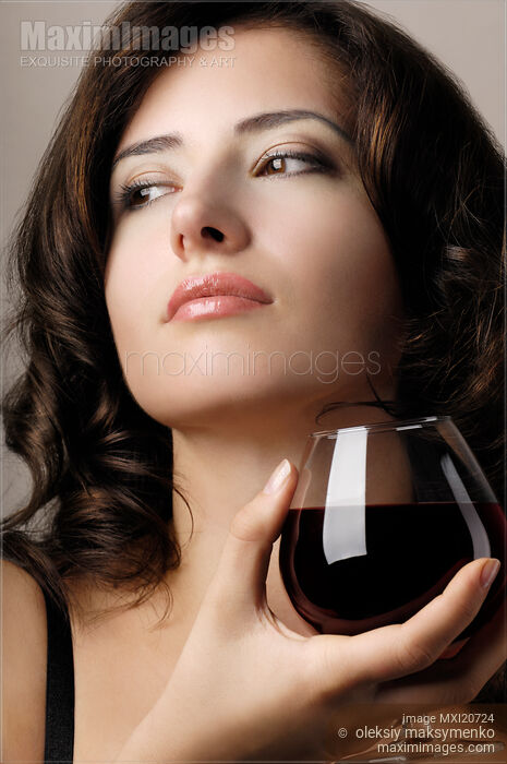 Stock photo of Beautiful Woman With Glass of Wine Buy commercial use license at MaximImages