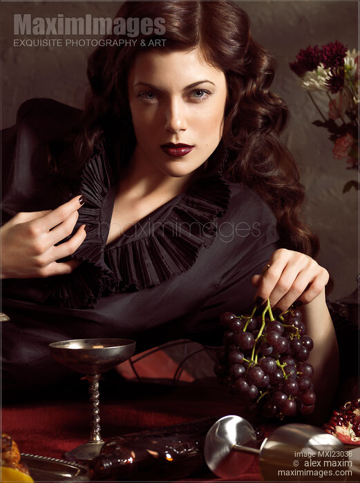 Beautiful Woman with Grapes Stock photo of Beautiful Woman with Grapes Buy commercial use license at MaximImages