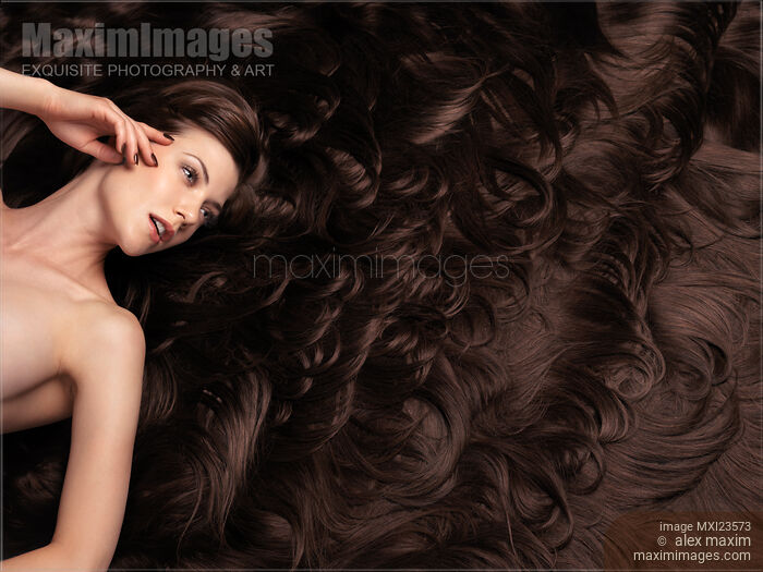 Stock photo of Beautiful Woman with Hair Extensions Buy commercial use license at MaximImages