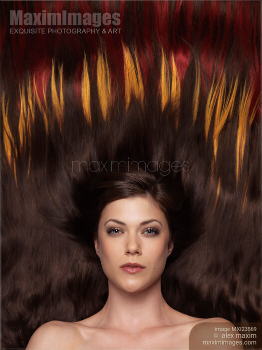 Stock photo of Beautiful Woman with Hair Extensions in a Shape of Fire Buy commercial use license at MaximImages