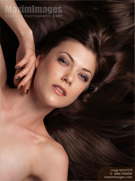 Stock photo of Beautiful Woman with Long Brown Hair Buy commercial use license at MaximImages