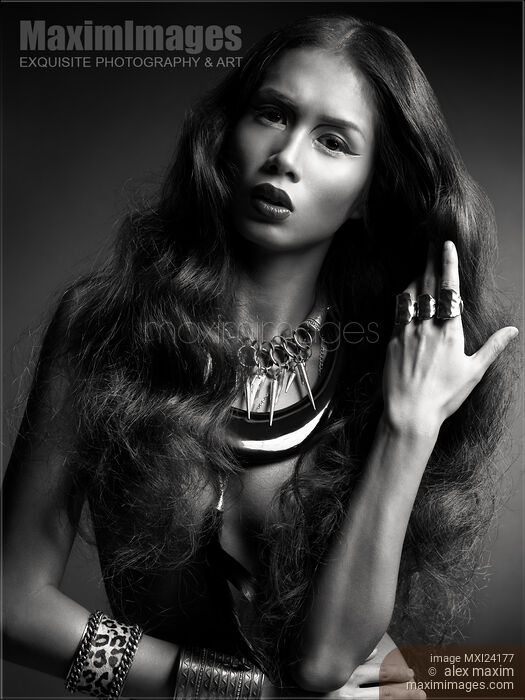 Beautiful woman with long hair wearing jewelry black and white photo Stock photo of Beautiful woman with long hair wearing jewelry black and white photo Buy commercial use license at MaximImages