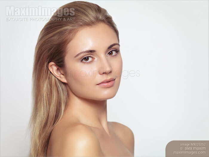 Stock photo of Beautiful woman with long light brown hair and clean look Buy commercial use license at MaximImages