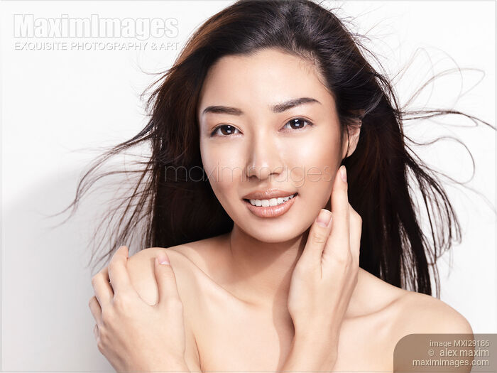 Beautiful young smiling asian woman beauty portrait Stock photo of Beautiful young smiling asian woman beauty portrait Buy commercial use license at MaximImages