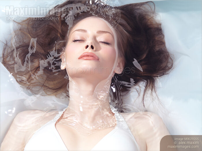 Beautiful young woman face and hair in clear water Beauty portrait Stock photo of Beautiful young woman face and hair in clear water Beauty portrait Buy commercial use license at MaximImages