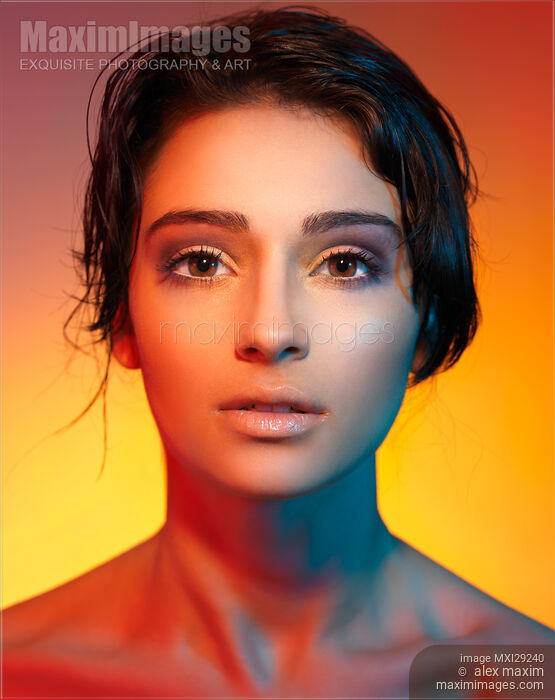 Stock photo of Beautiful Young Woman Face Multicolor Portrait Buy commercial use license at MaximImages