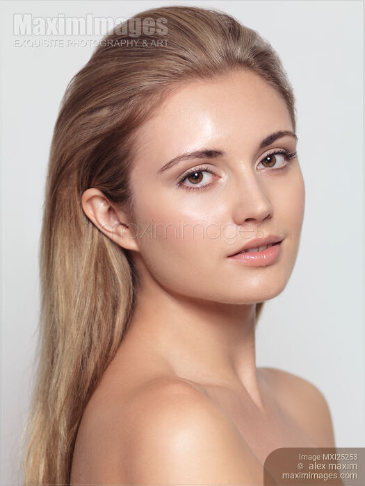 Stock photo of Beautiful young woman face with natural look Buy commercial use license at MaximImages