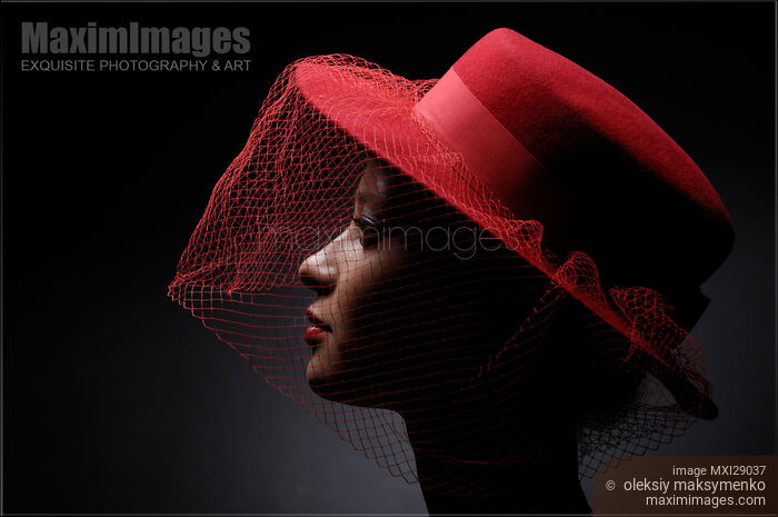Beautiful Young Woman in a Veiled Hat Stock photo of Beautiful Young Woman in a Veiled Hat Buy commercial use license at MaximImages
