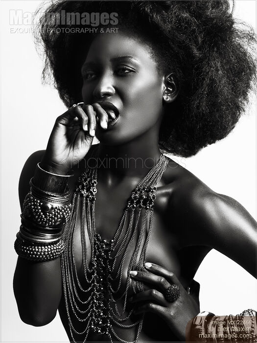 Stock photo of Beautiful Young Woman Wearing Jewelry Buy commercial use license at MaximImages