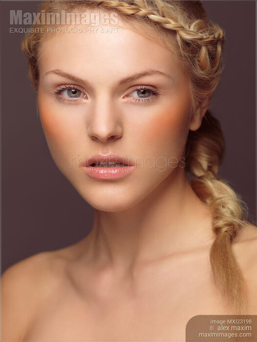 Beautiful Young Woman with a Braid Stock photo of Beautiful Young Woman with a Braid Buy commercial use license at MaximImages