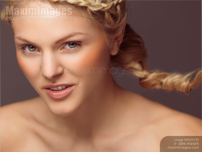 Beautiful Young Woman with a Braid Stock photo of Beautiful Young Woman with a Braid Buy commercial use license at MaximImages