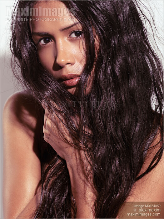 Beautiful young woman with long hair Stock photo of Beautiful young woman with long hair Buy commercial use license at MaximImages