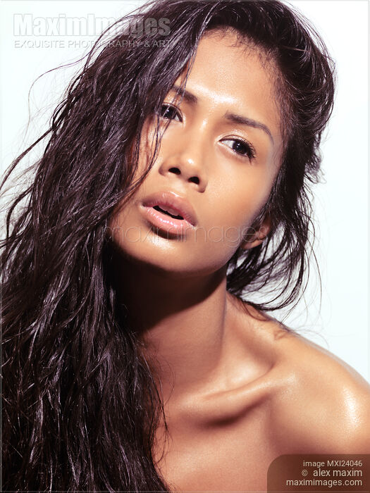 Beautiful young woman with long wet hair Stock photo of Beautiful young woman with long wet hair Buy commercial use license at MaximImages