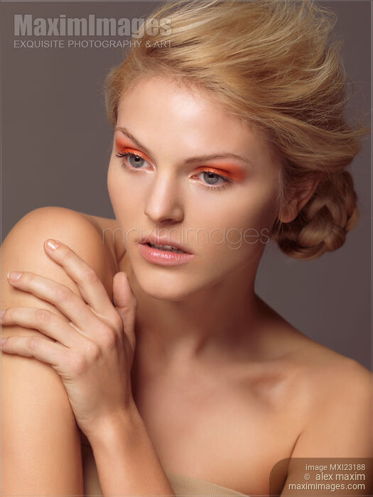 Beautiful Young Woman with Orange Eyeshadows Stock photo of Beautiful Young Woman with Orange Eyeshadows Buy commercial use license at MaximImages