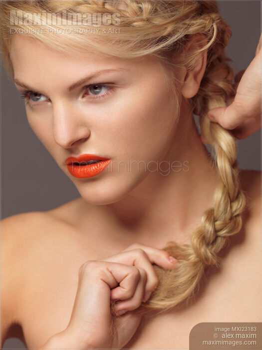 Beautiful Young Woman with Orange Lipstick Stock photo of Beautiful Young Woman with Orange Lipstick Buy commercial use license at MaximImages