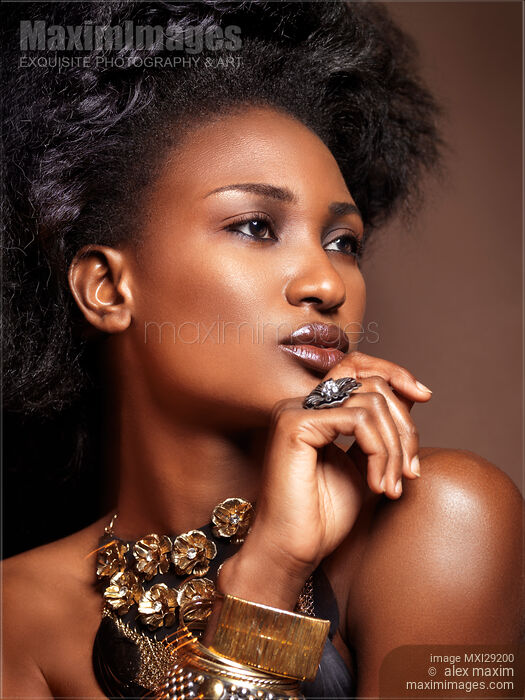 Stock photo of Beauty face portrait of black african american woman wearing jewelry Buy commercial use license at MaximImages