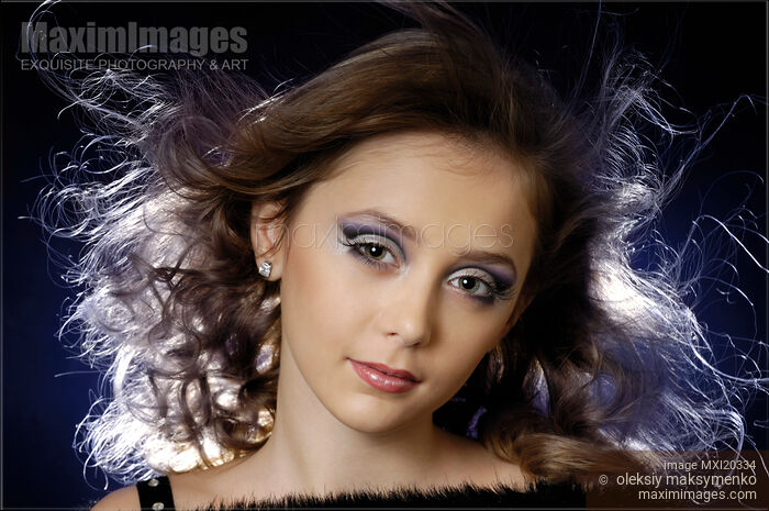 Stock photo of Beauty portrait of a girl with flying hair Buy commercial use license at MaximImages