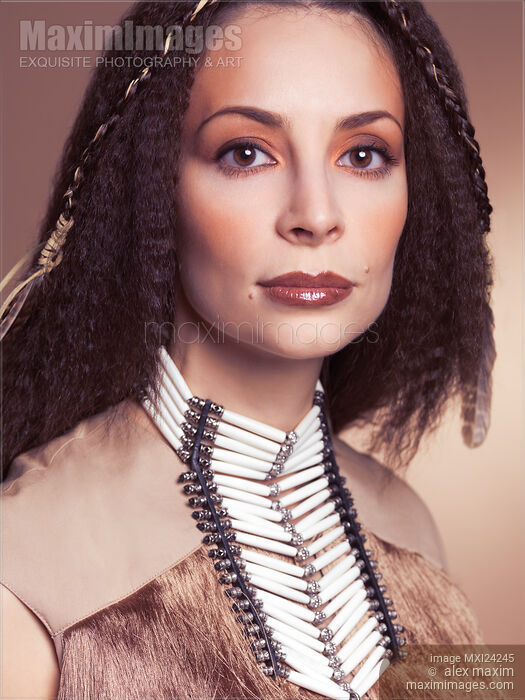 Stock photo of Beauty portrait of a woman wearing aboriginal accessories Buy commercial use license at MaximImages