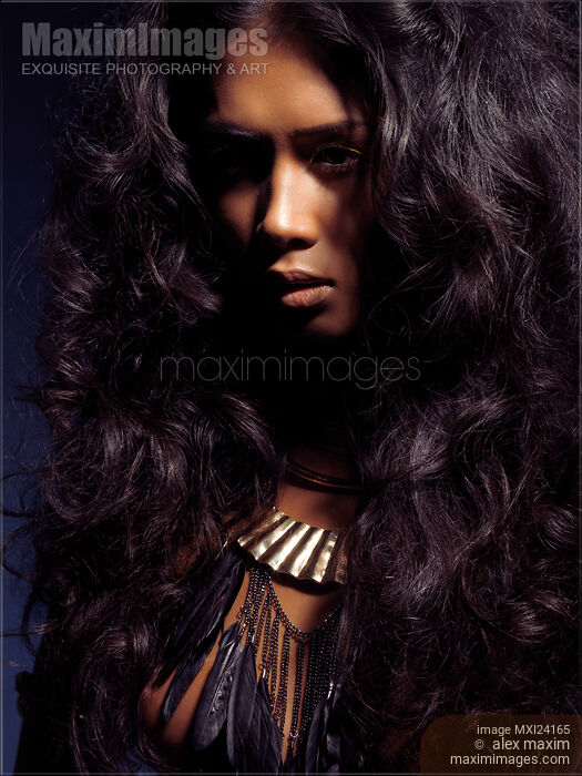 Beauty portrait of a woman with long dark hair Stock photo of Beauty portrait of a woman with long dark hair Buy commercial use license at MaximImages