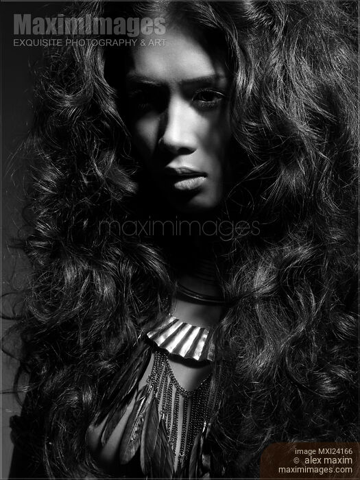 Beauty portrait of a woman with long dark hair black and white Stock photo of Beauty portrait of a woman with long dark hair black and white Buy commercial use license at MaximImages