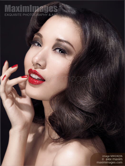 Beauty portrait of a woman with red lipstick Stock photo of Beauty portrait of a woman with red lipstick Buy commercial use license at MaximImages