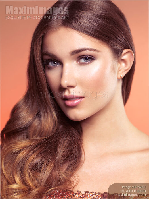 Beauty portrait of a young woman face with wavy brown hair neatly brushed to one side Stock photo of Beauty portrait of a young woman face with wavy brown hair neatly brushed to one side Buy commercial use license at MaximImages