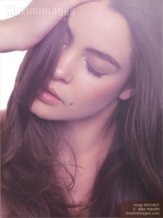 Beauty portrait of a young woman with closed eyes Stock photo of Beauty portrait of a young woman with closed eyes Buy commercial use license at MaximImages