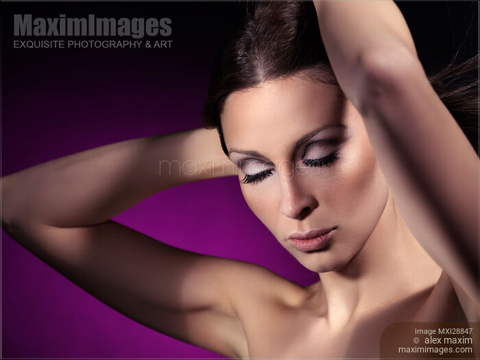 Stock photo of Beauty portrait of a young woman with closed eyes and artistic makeup Buy commercial use license at MaximImages