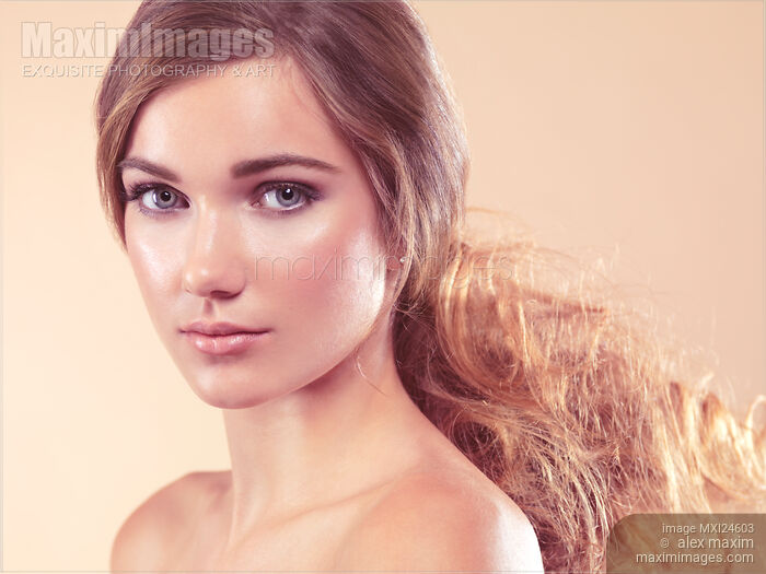 Stock photo of Beauty portrait of a young woman with soft natural look Buy commercial use license at MaximImages