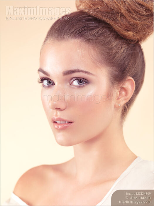 Stock photo of Beauty portrait of a young woman with updo Buy commercial use license at MaximImages