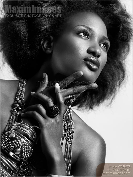 Stock photo of Beauty portrait of african american woman wearing jewellery black and white Buy commercial use license at MaximImages
