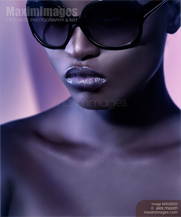 Stock photo of Beauty portrait of black woman in sunglasses Buy commercial use license at MaximImages