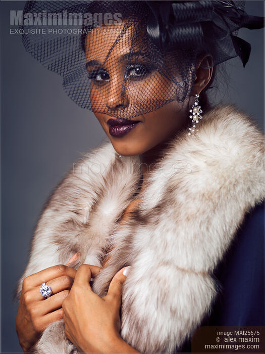 Stock photo of Beauty portrait of black woman with veil Buy commercial use license at MaximImages
