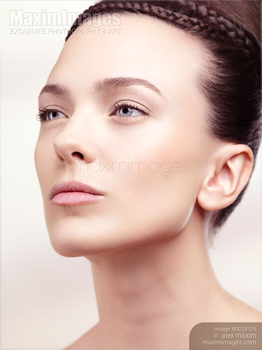 Beauty portrait of woman with clean natural look and updo hairstyle Stock photo of Beauty portrait of woman with clean natural look and updo hairstyle Buy commercial use license at MaximImages