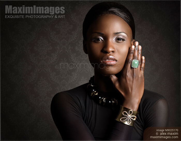 Stock photo of Beauty Portrait of Young Black Woman Wearing Jewellery Buy commercial use license at MaximImages