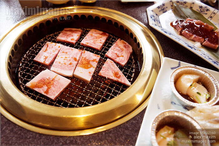 Stock photo of Beef being cooked on grill at Japanese restaurant Buy commercial use license at MaximImages