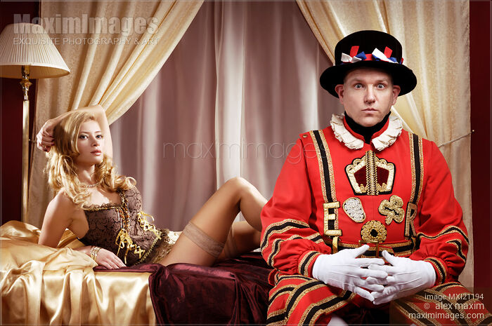 Stock photo of Beefeater, Royal bodyguard and a beautiful sexy lady sitting on a bed Buy commercial use license at MaximImages