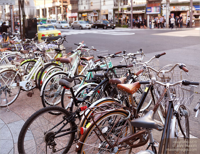 Stock photo of Bicycles parked on streets of Kyoto Buy commercial use license at MaximImages