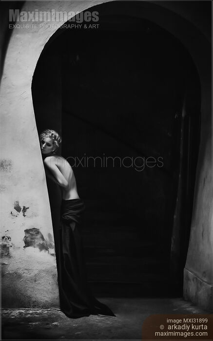 Black and white artistic half-nude portrait of a young woman leaning against archway wall Stock photo of Black and white artistic half-nude portrait of a young woman leaning against archway wall Buy commercial use license at MaximImages