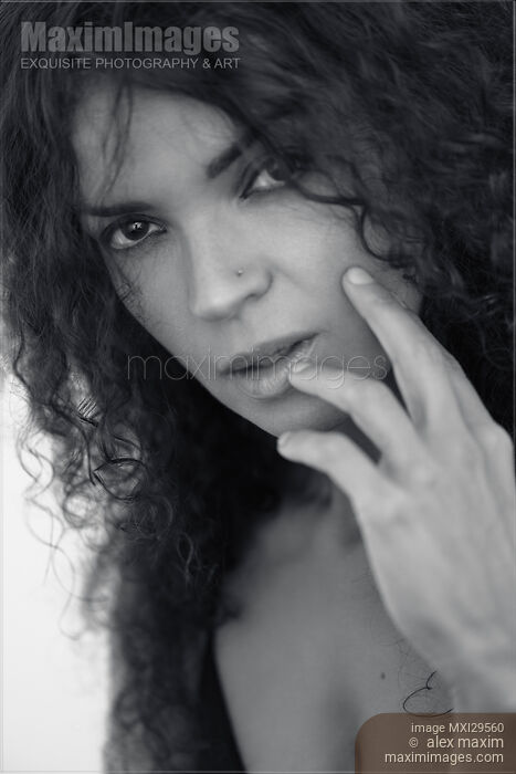 Black and white face portrait of a young brunette woman with a deep expressive look Stock photo of Black and white face portrait of a young brunette woman with a deep expressive look Buy commercial use license at MaximImages