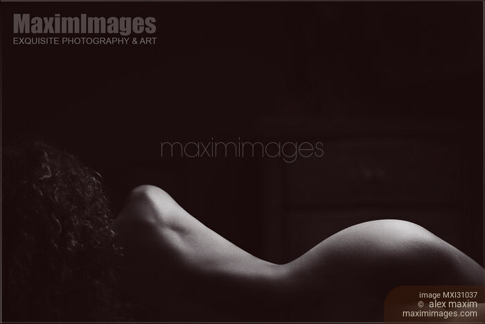 Black and white outline of a nude woman back silhouette in dark bedroom Stock photo of Black and white outline of a nude woman back silhouette in dark bedroom Buy commercial use license at MaximImages