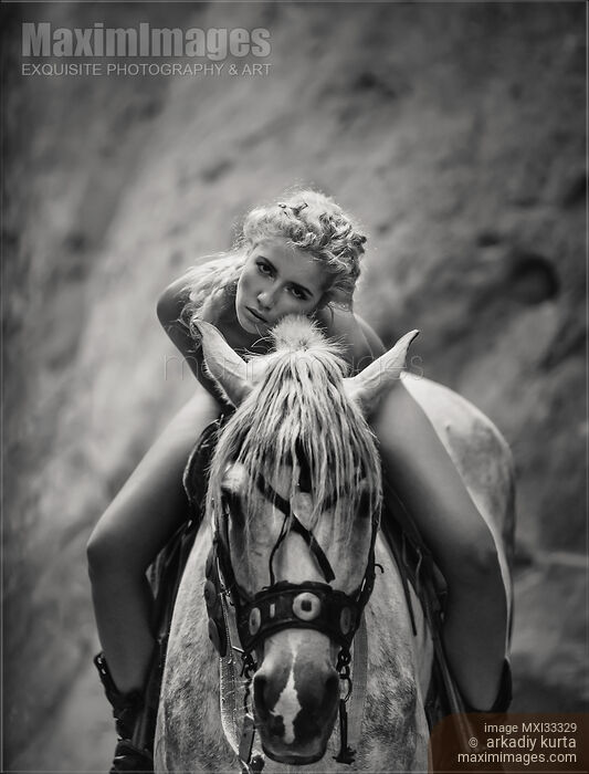 Black and white portrait of a beautiful young woman sitting naked on a horse Stock photo of Black and white portrait of a beautiful young woman sitting naked on a horse Buy commercial use license at MaximImages